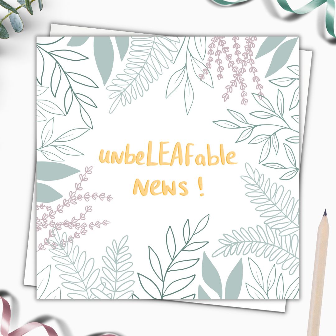 Botanical greeting card with leaves, petals and floral details forming a border/frame around the words "UnbeLEAFable News!" in the centre. The colours are various shades of green with a little touch of deep pink. The lettering in the centre is in yellow gold.