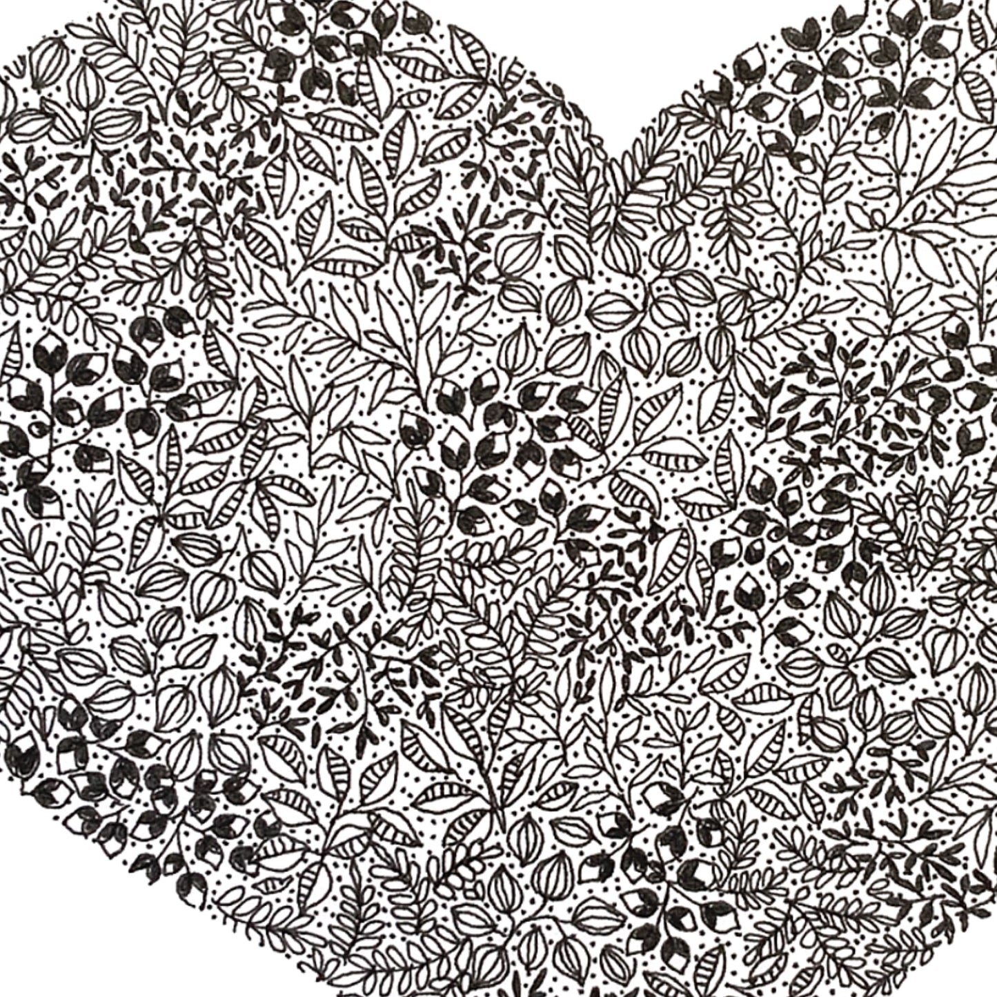 image shows close up of the Heart drawing in great detail displaying the black and white floral drawings and design. 